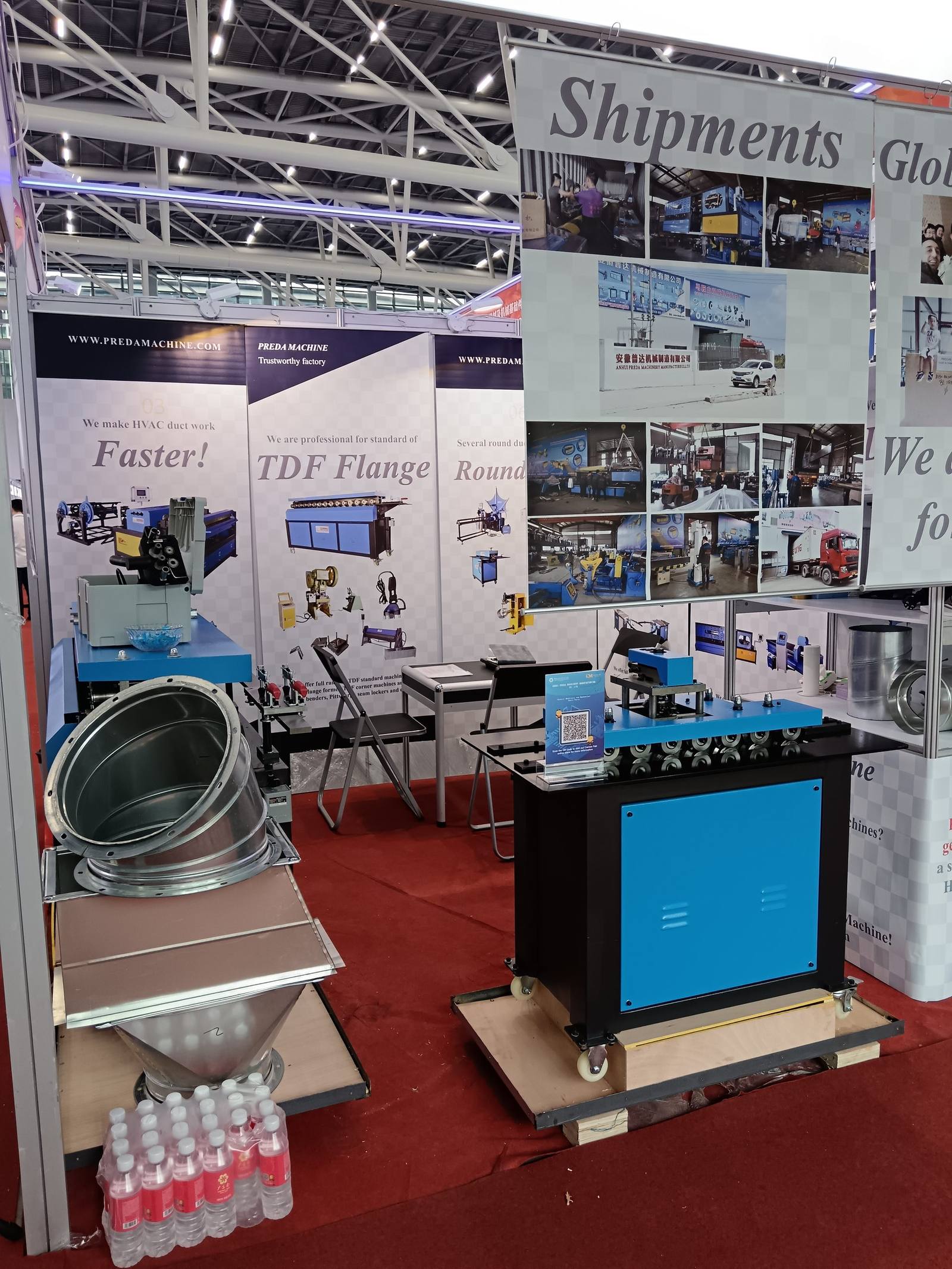 Exhibition booth with product displays and shipment showcase wall
