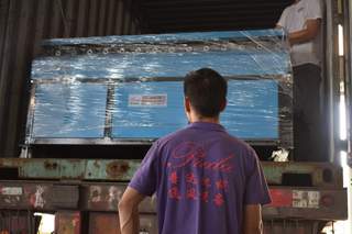 Loading TDF flange machine into container - Preda team